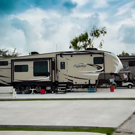 An overview of Copano Bay RV Resort in Rockport, TX, displaying various RV parked amidst a picturesque landscape.